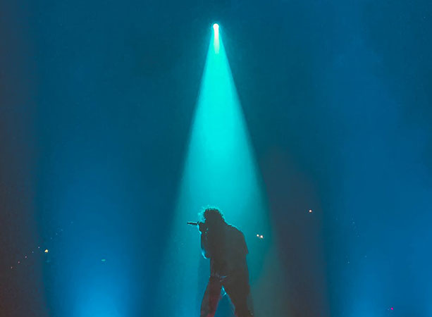 Musicians & Artists on stage with a spotlight