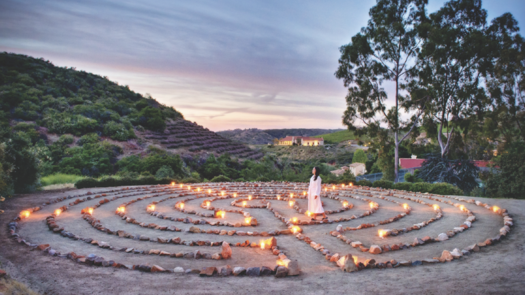 ying and yang built with rocks and candles