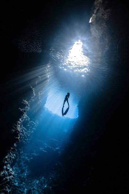 a woman snorkeling
