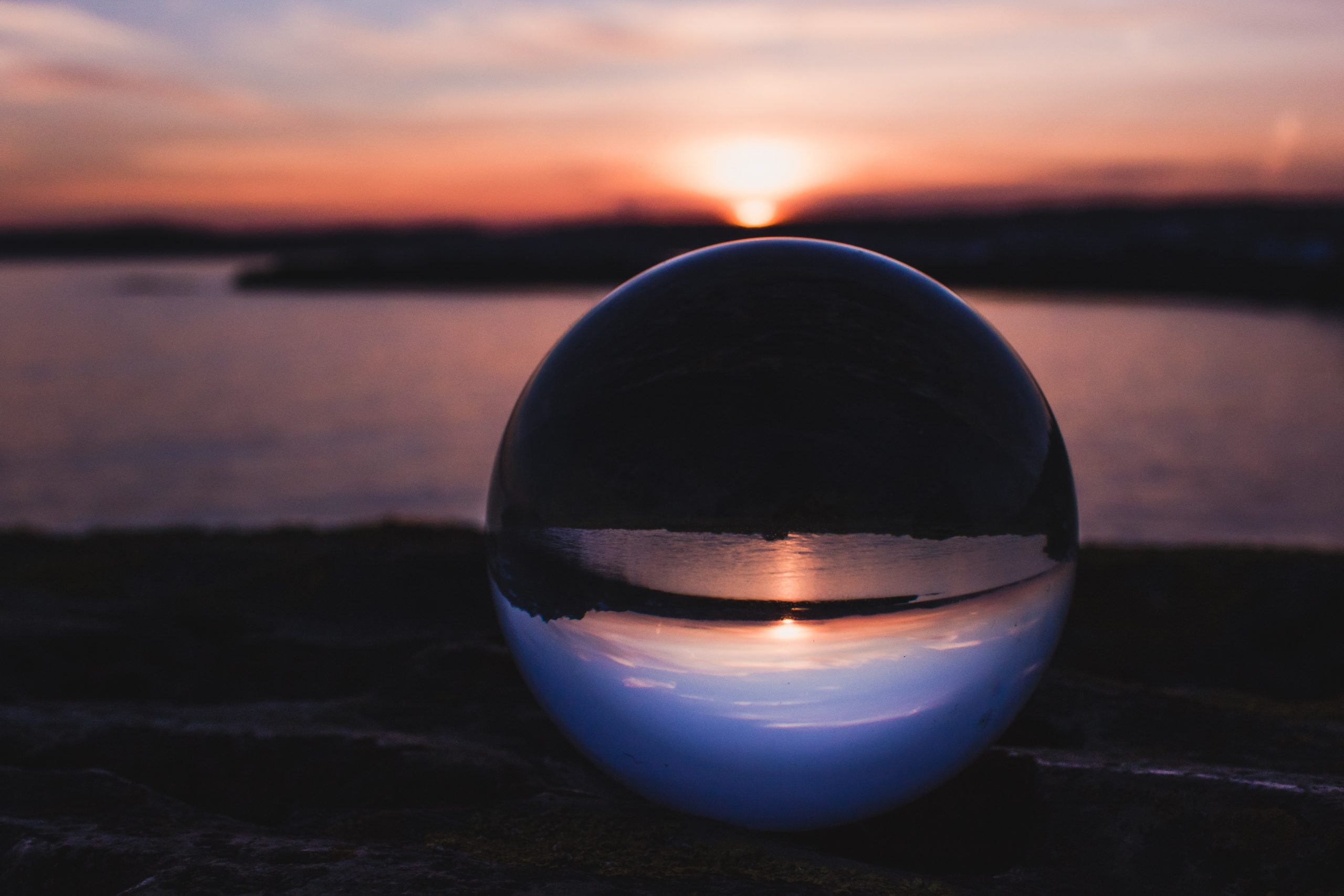 a glass ball, overlooking the sunset