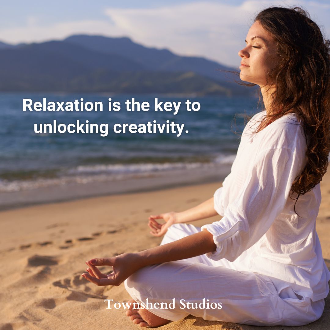 Woman in white meditating on the beach