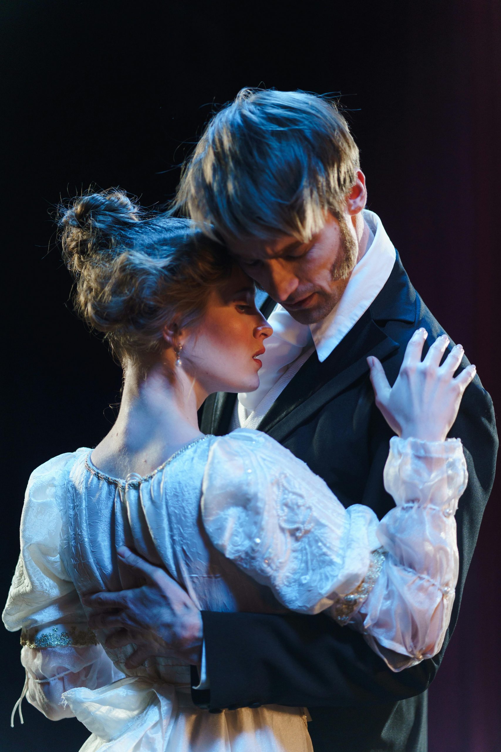 A woman and man dancing together
